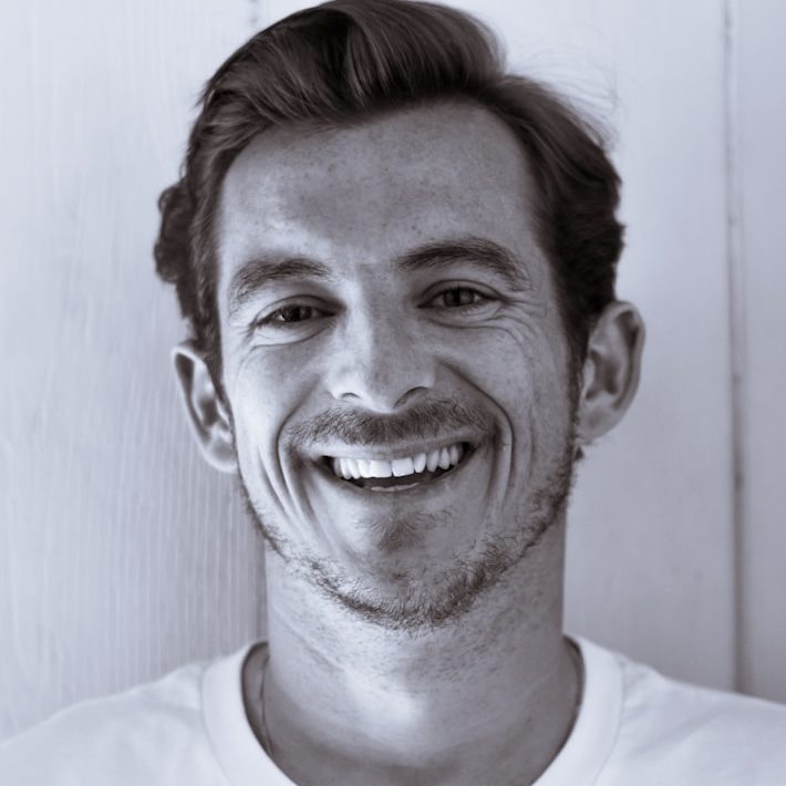 grayscale photography of man smiling